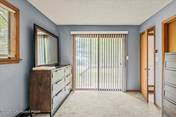 a view of a bedroom with windows