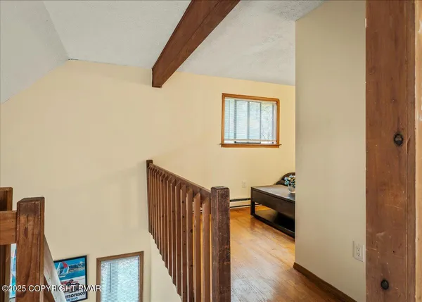 a picture of a bathroom with a sink and a picture on the wall