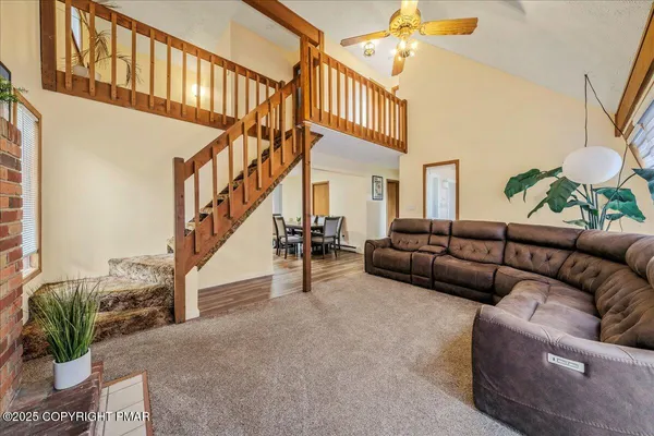 a living room with furniture or stairs and a couch