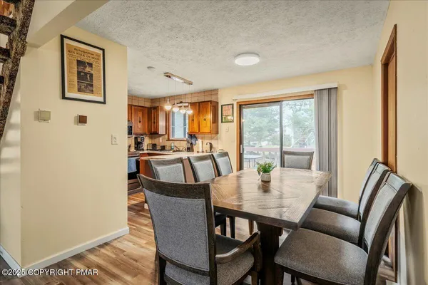 a view of a dining room with furniture window and outside view