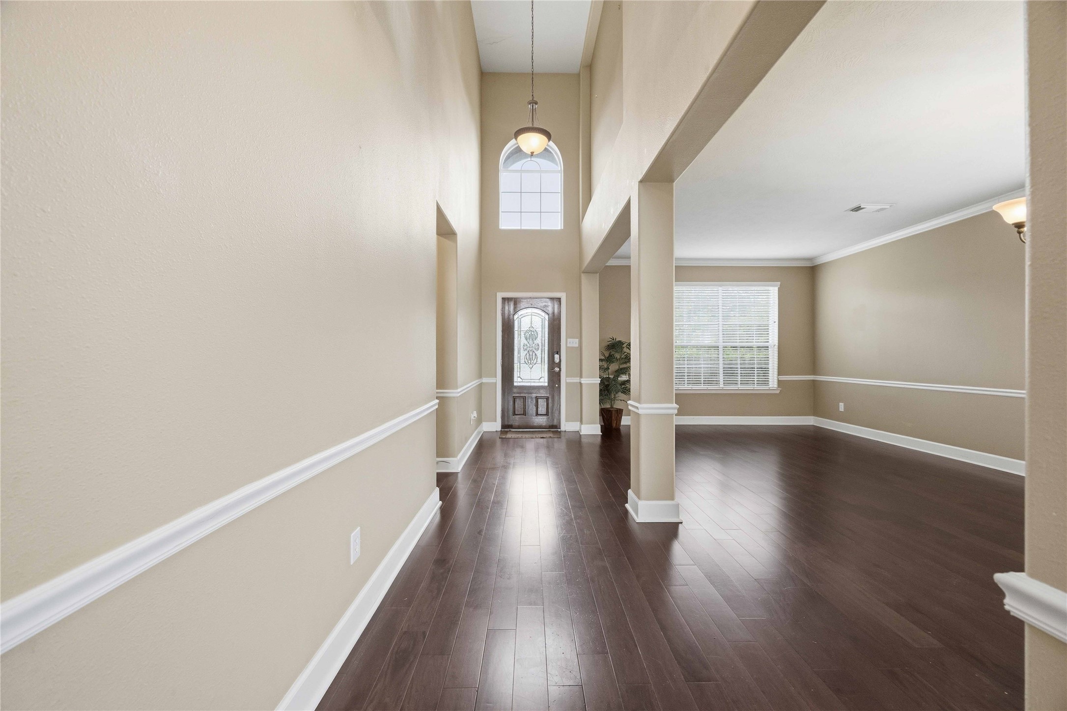 803 Northridge Terrace Lane Spring, TX 77373 - Photo 4 of 42 a hallway with wooden floor chandelier and entryway