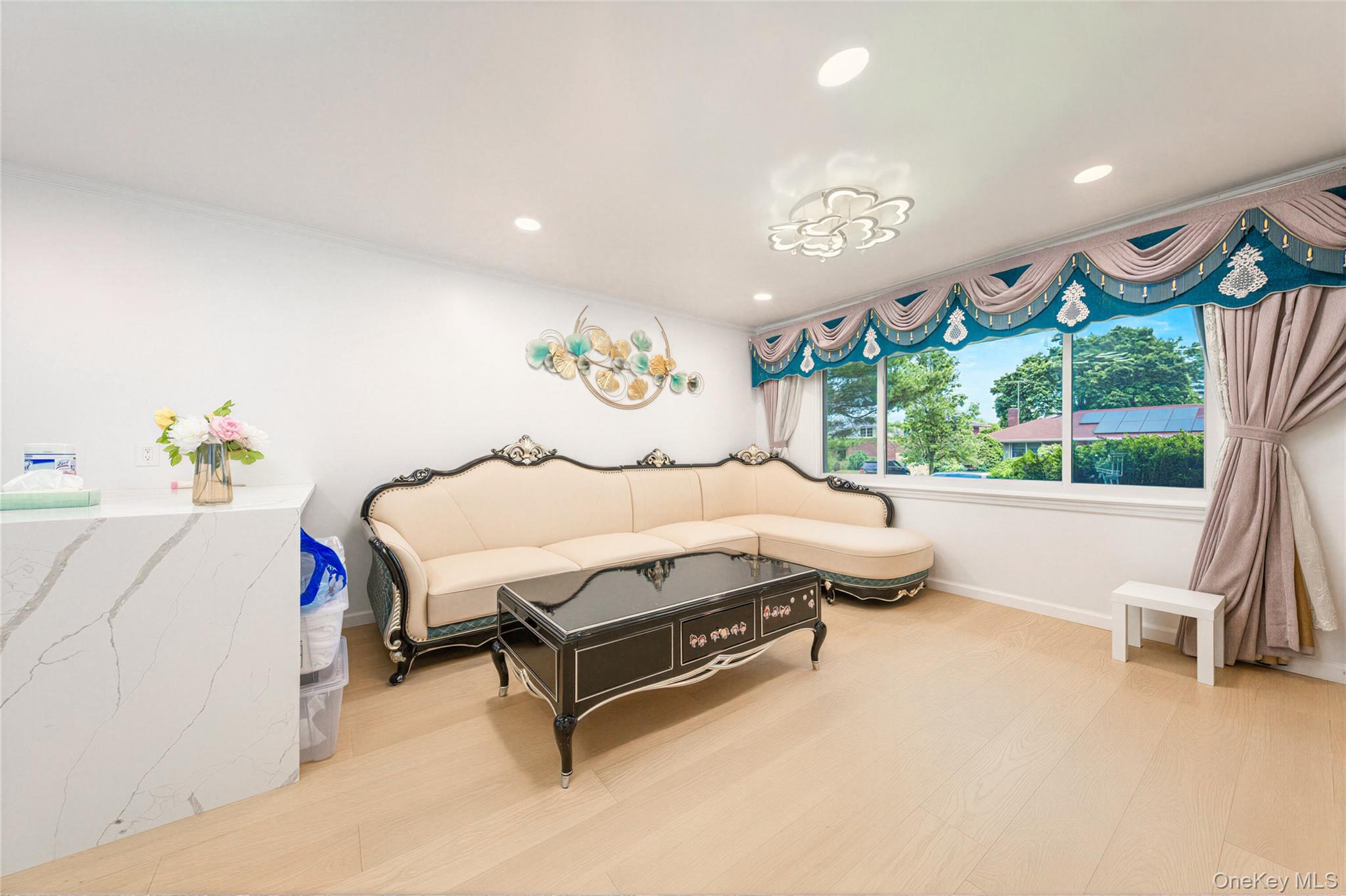 105 Seaman Road Jericho, NY 11753 - Photo 7 of 11 a spacious bedroom with a bed and a large window