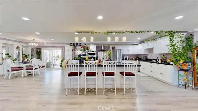 a kitchen with a dining table and chairs