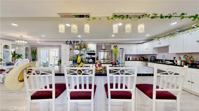 a view of a kitchen and dining area