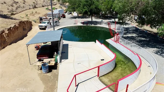 an aerial view of a house with outdoor space
