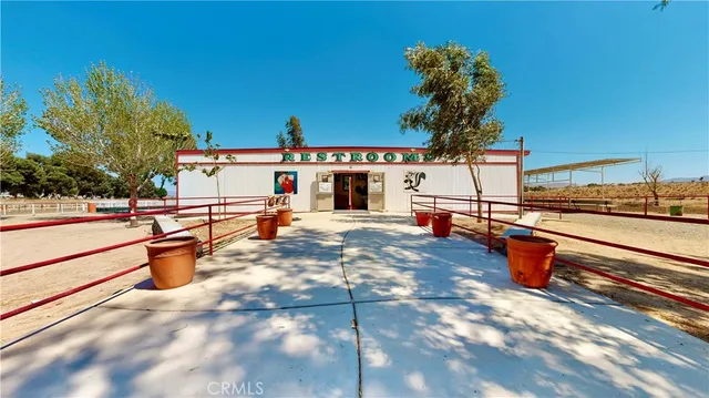 a view of an outdoor kitchen and swimming pool