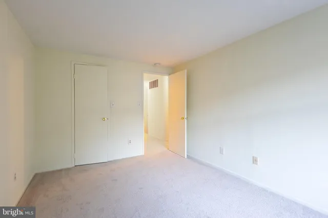 a view of an empty room and entryway
