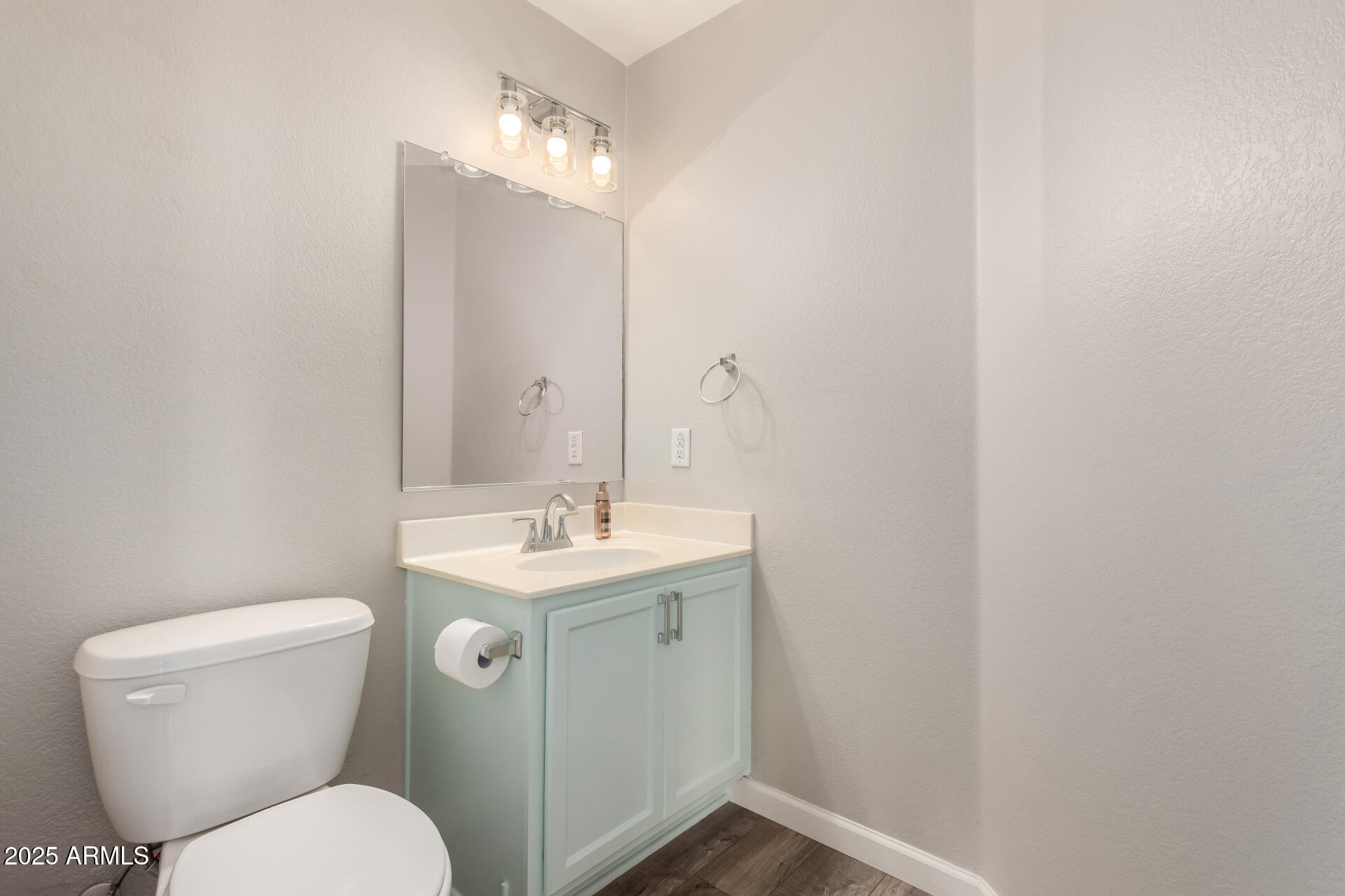 2725 East Mine Creek Road, Unit 1010 Phoenix, AZ 85024 - Photo 11 of 35 a bathroom with a toilet sink and mirror