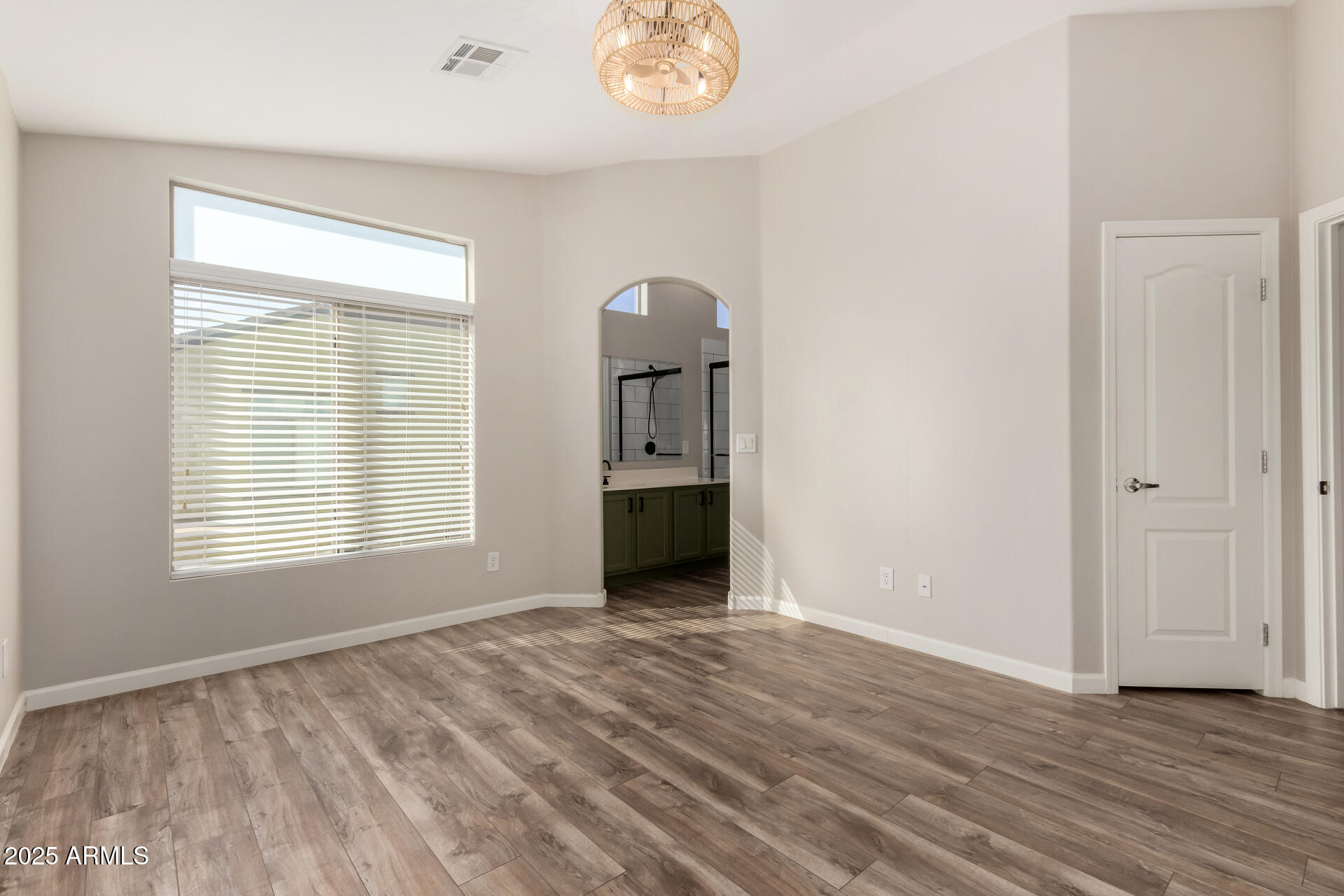 2725 East Mine Creek Road, Unit 1010 Phoenix, AZ 85024 - Photo 14 of 35 wooden floor in an empty room with a window