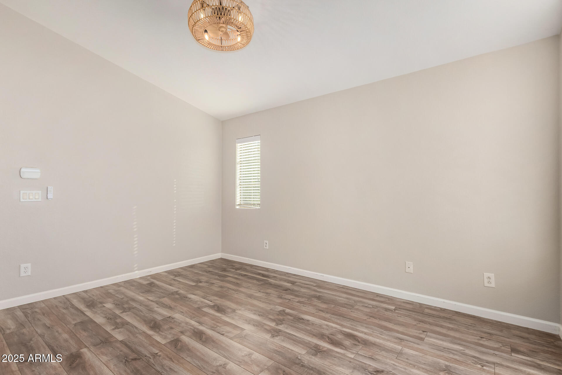 2725 East Mine Creek Road, Unit 1010 Phoenix, AZ 85024 - Photo 15 of 35 an empty room with a window
