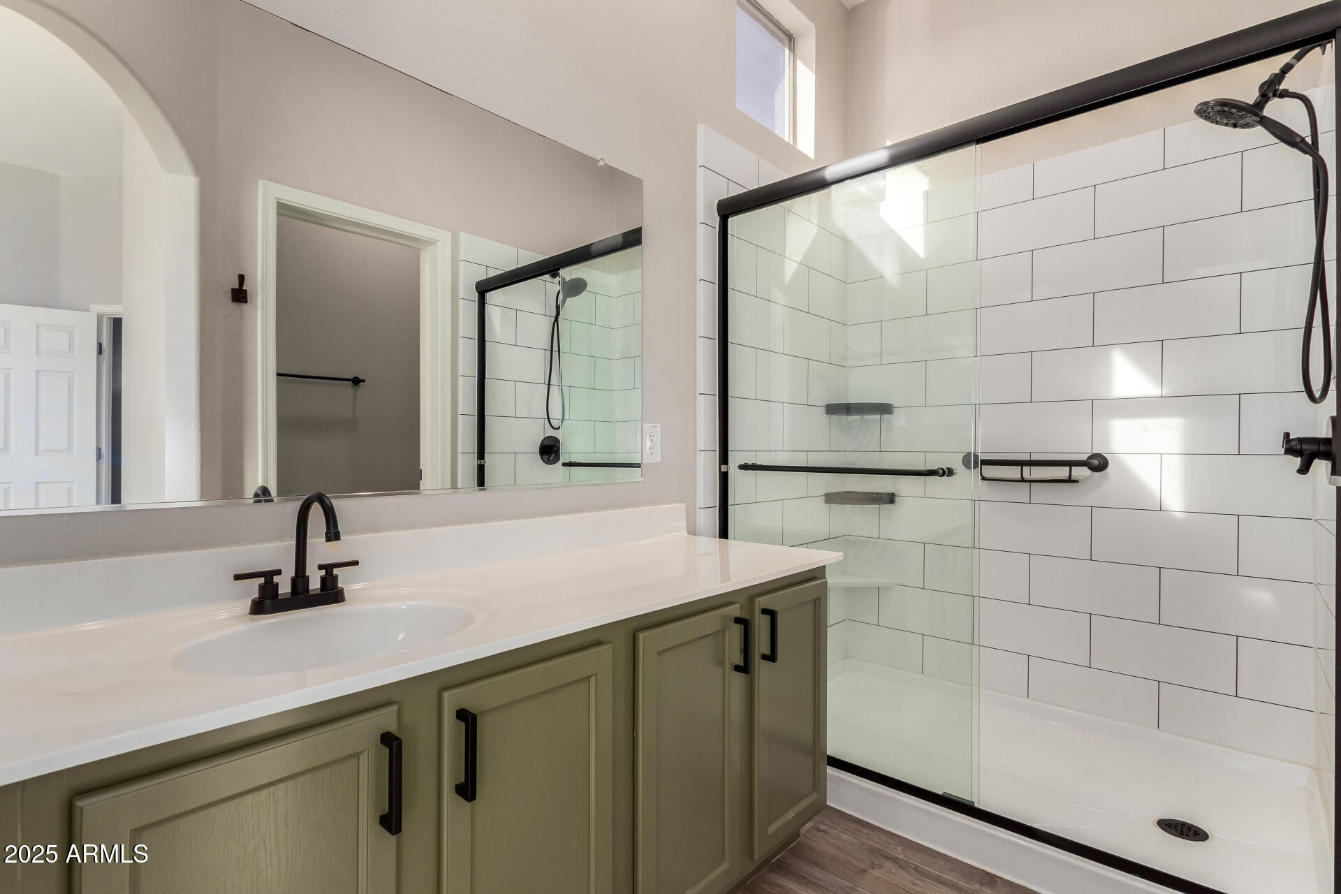 2725 East Mine Creek Road, Unit 1010 Phoenix, AZ 85024 - Photo 16 of 35 a bathroom with a sink shower and a mirror