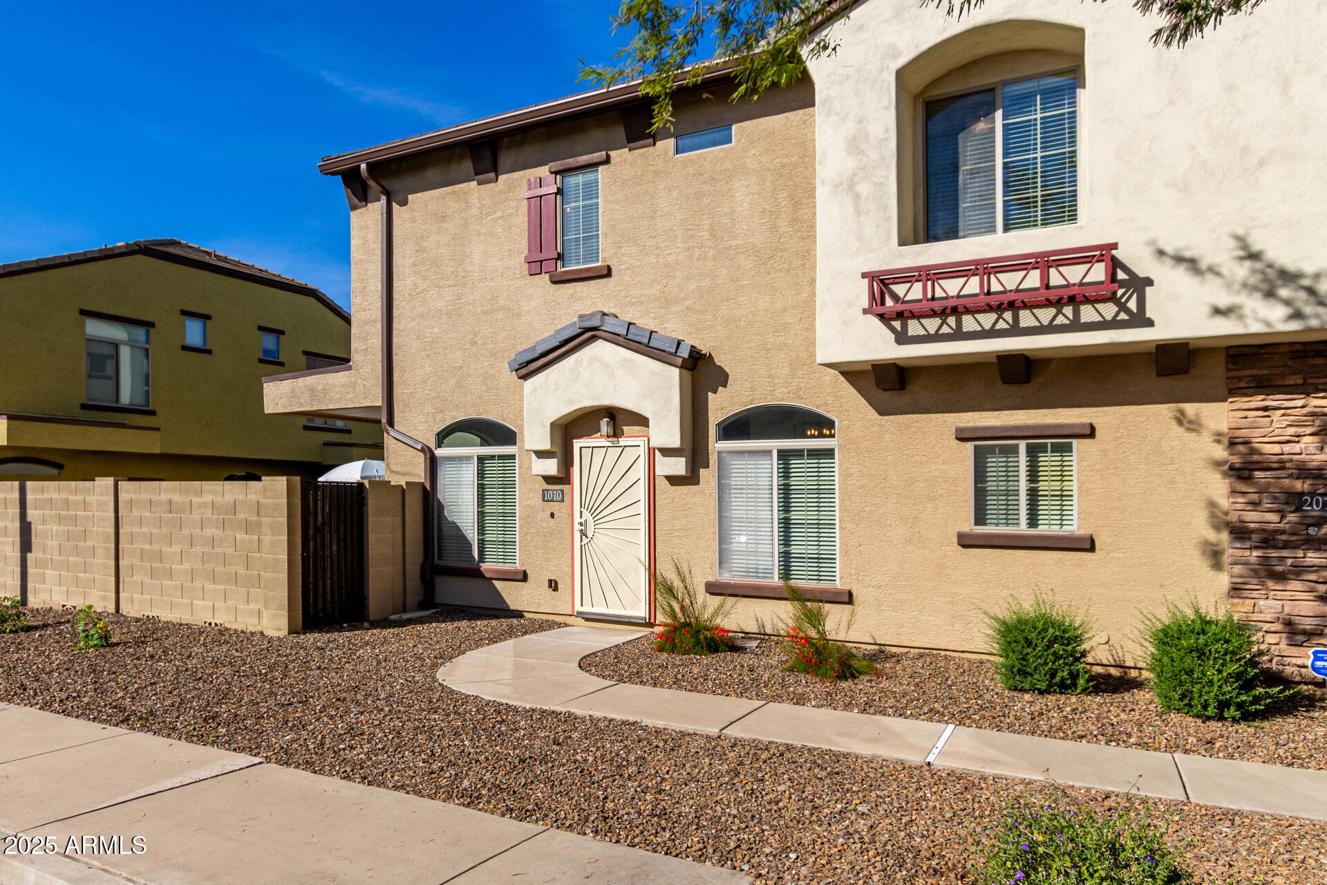2725 East Mine Creek Road, Unit 1010 Phoenix, AZ 85024 - Photo 2 of 35 a front view of a house with garden