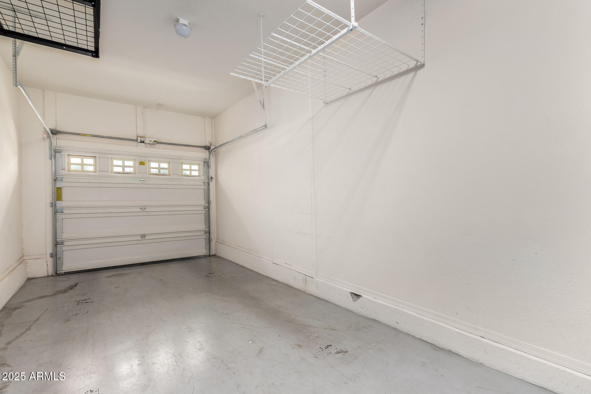 2725 East Mine Creek Road, Unit 1010 Phoenix, AZ 85024 - Photo 23 of 35 an empty room with windows