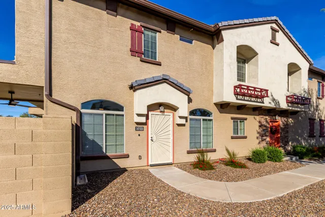 a front view of a house with garage