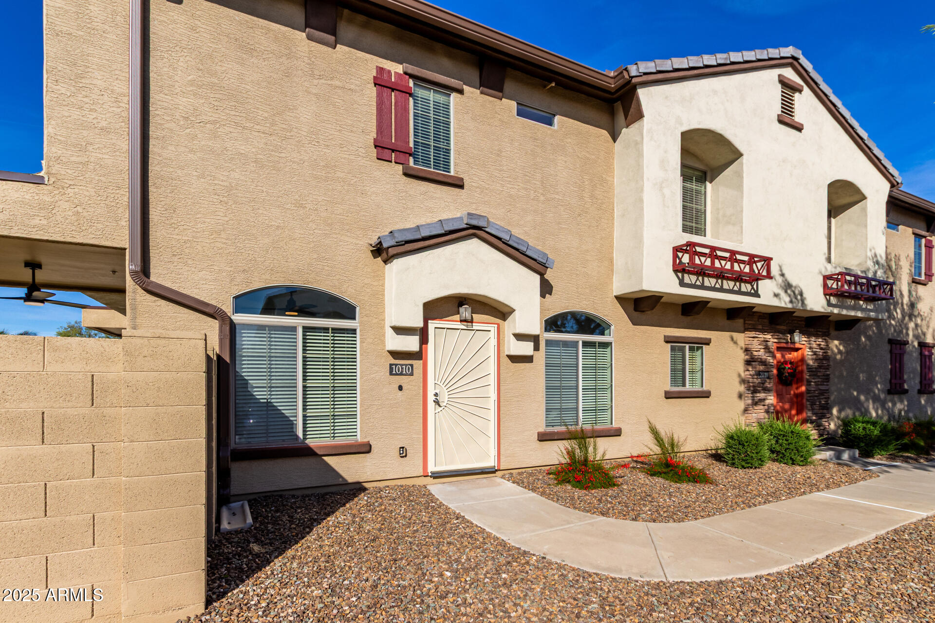 2725 East Mine Creek Road, Unit 1010 Phoenix, AZ 85024 - Photo 3 of 35 a front view of a house with garage