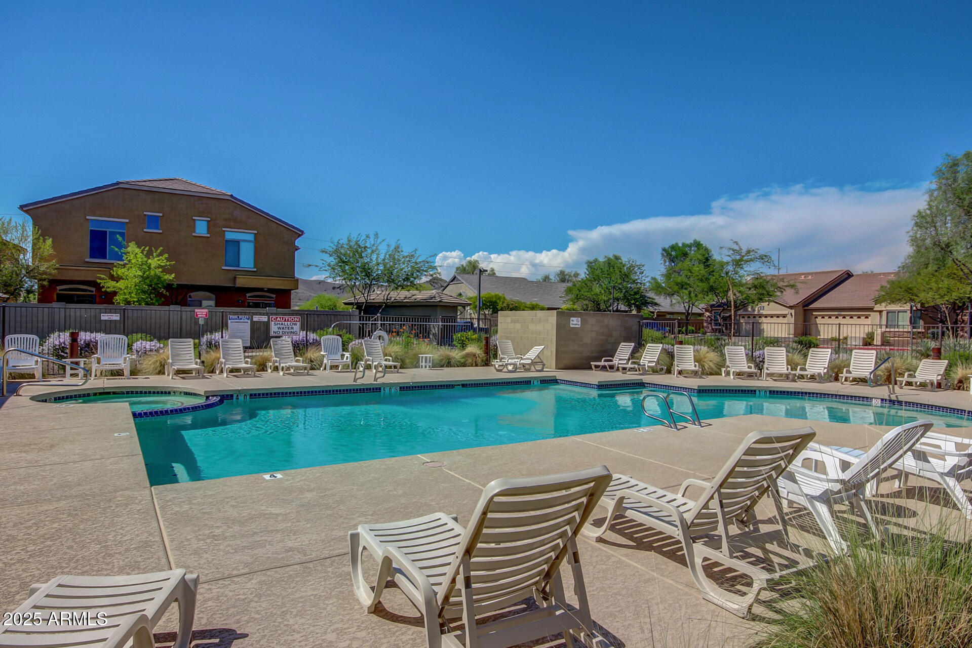 2725 East Mine Creek Road, Unit 1010 Phoenix, AZ 85024 - Photo 33 of 35 a view of swimming pool with outdoor seating and plants