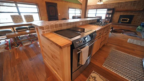 a front view of a house with a yard table and chairs