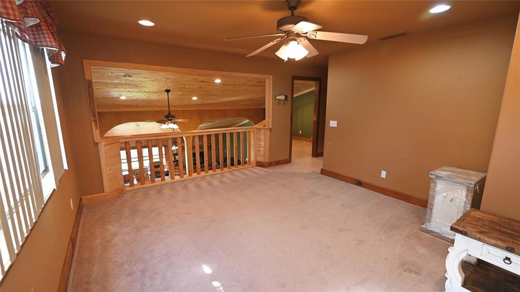 2377 Casino Road Nocona, TX 76255 - Photo 22 of 40 a view of a livingroom with a ceiling fan and a rug