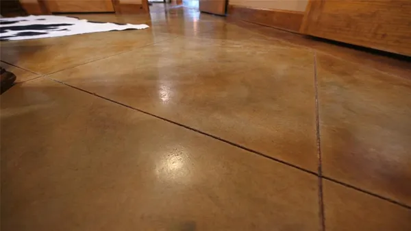 an aerial view of a house with swimming pool garden and patio