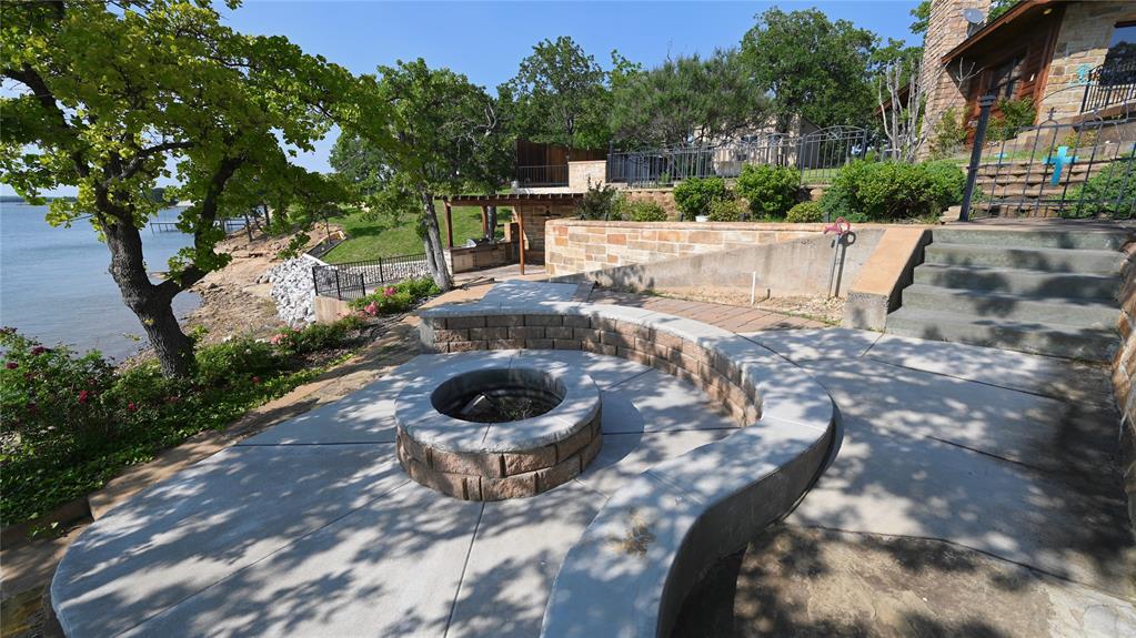 2377 Casino Road Nocona, TX 76255 - Photo 32 of 40 a view of a backyard with plants and a patio