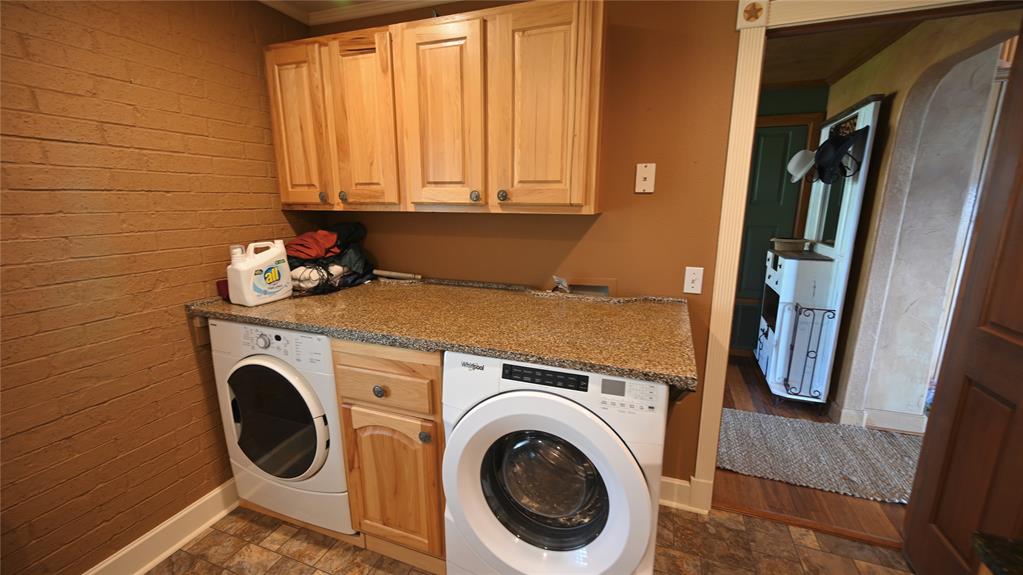 2377 Casino Road Nocona, TX 76255 - Photo 40 of 40 a utility room with dryer and washer
