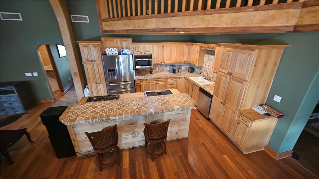 2377 Casino Road Nocona, TX 76255 - Photo 4 of 40 a dining room with furniture and wooden floor