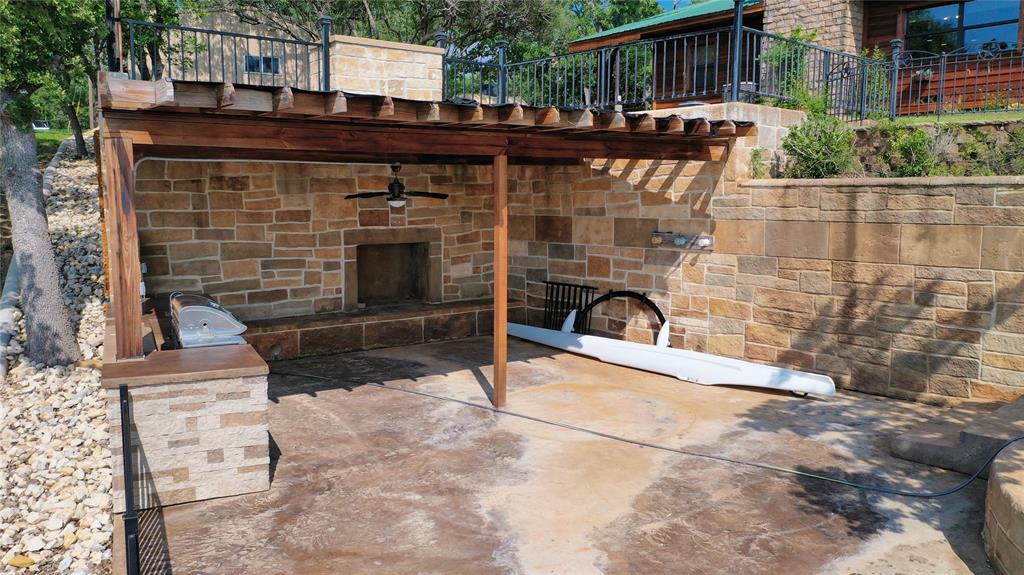 2377 Casino Road Nocona, TX 76255 - Photo 6 of 40 a view of a terrace with furniture and a fireplace