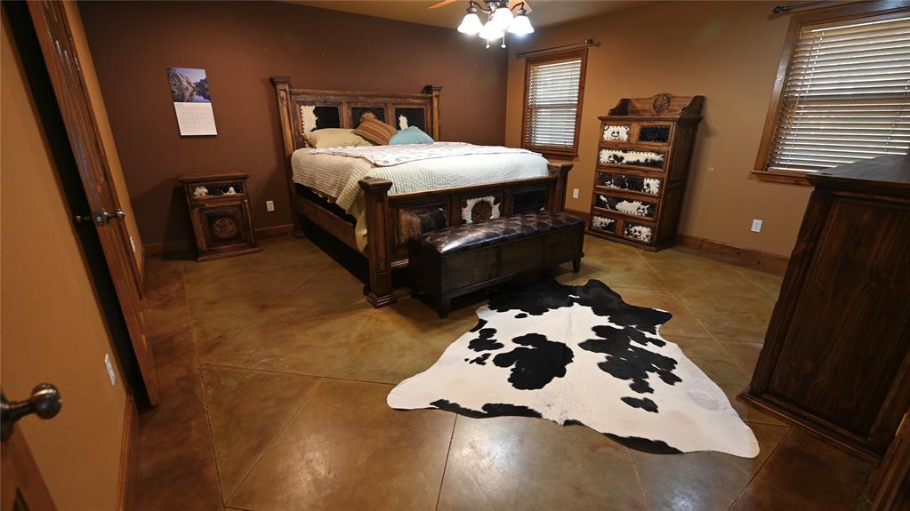 2377 Casino Road Nocona, TX 76255 - Photo 7 of 40 a bedroom with a bed and wooden floor
