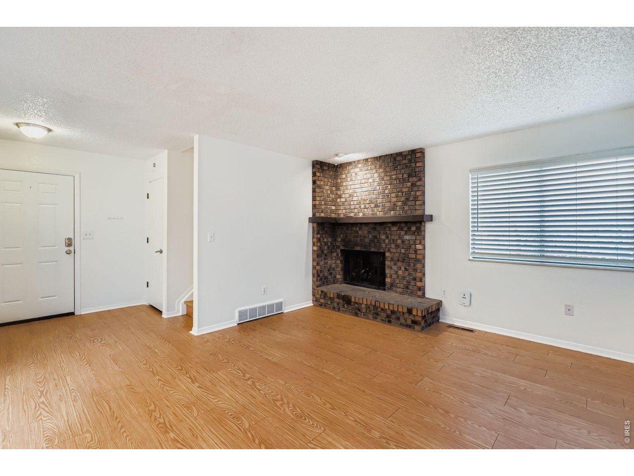 720 17th Street Boulder, CO 80302 - Photo 11 of 35 a view of empty room with fireplace