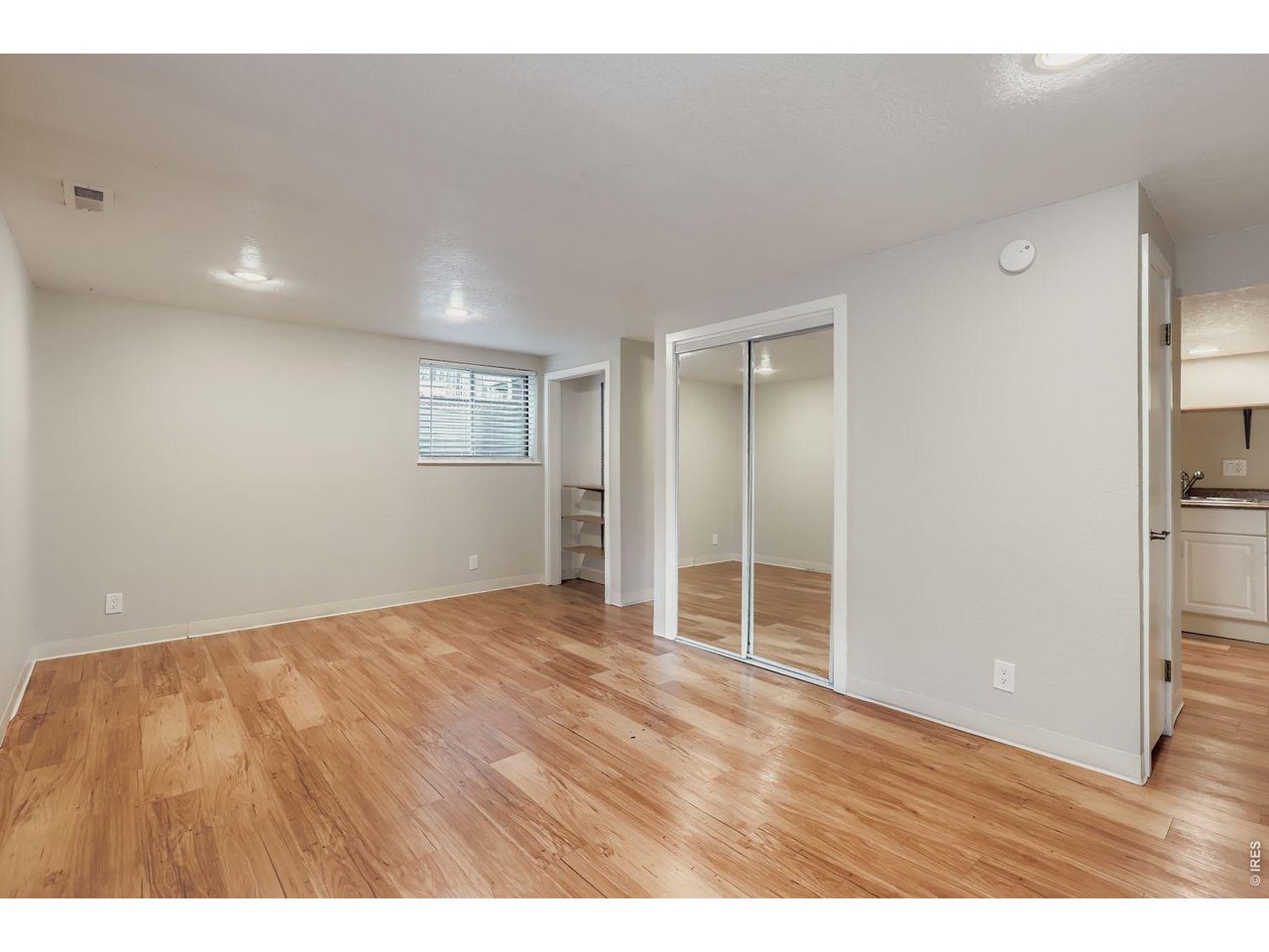 720 17th Street Boulder, CO 80302 - Photo 20 of 35 a view of an empty room with closet and windows