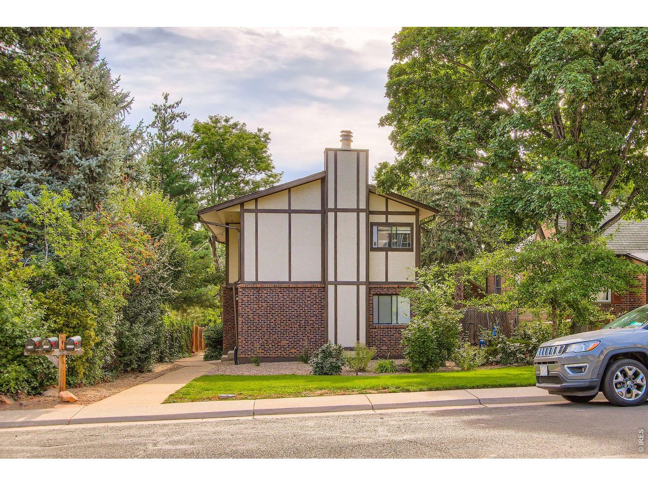 720 17th Street Boulder, CO 80302 - Photo 27 of 35 a view of a house with a yard and pathway