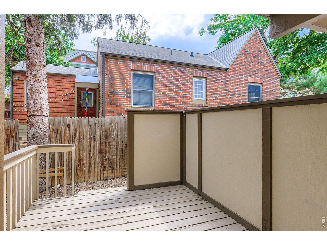 720 17th Street Boulder, CO 80302 - Photo 8 of 35 a view of a house with a wooden fence