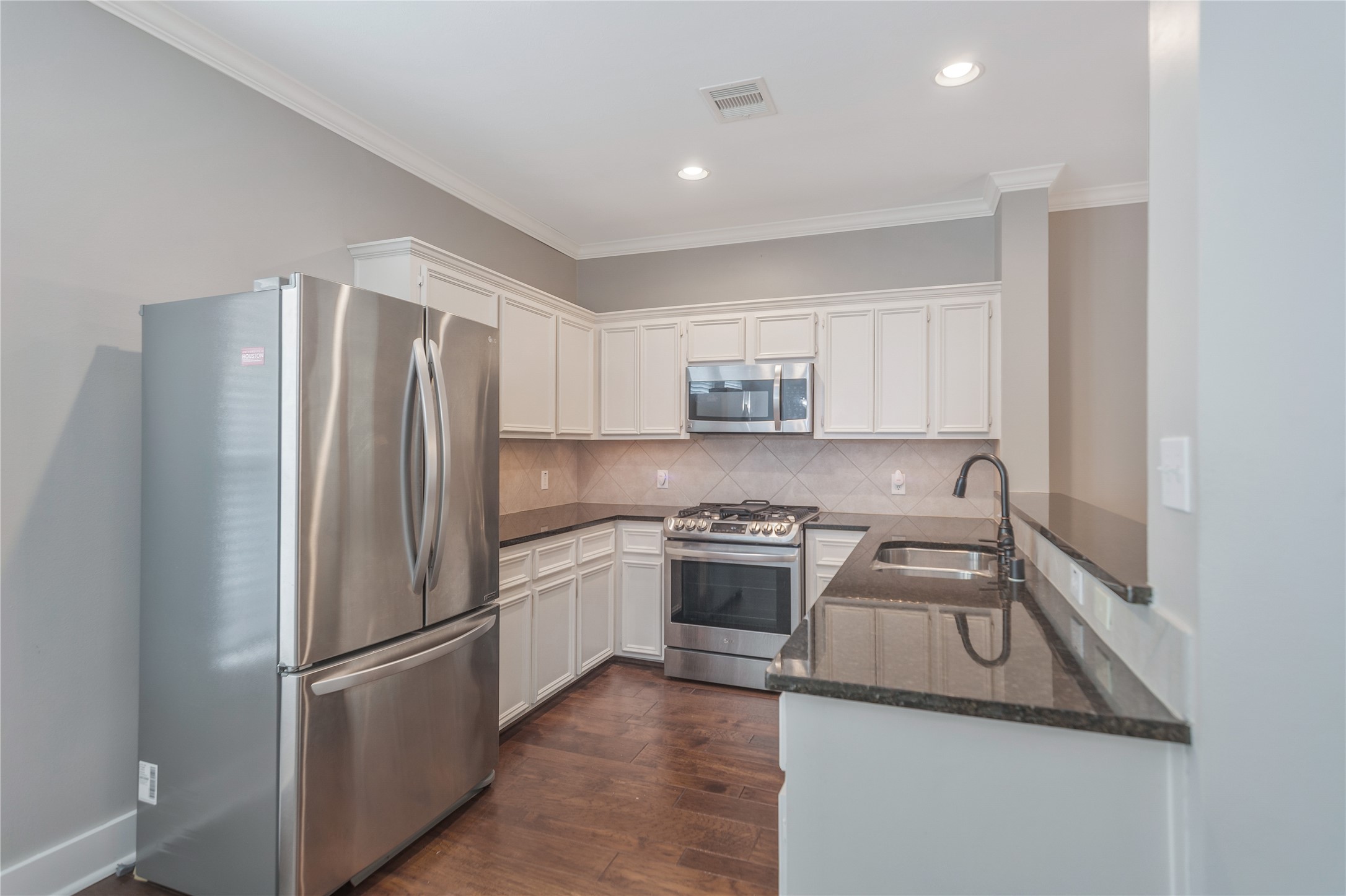 1207 Nagle Street Houston, TX 77003 - Photo 13 of 26 The kitchen features plenty of cabinets and countertop space. Recessed Lighting and crown molding. (Refrigerator is negotiable).