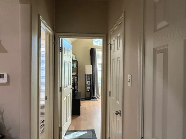 a view of a bathroom from a hallway