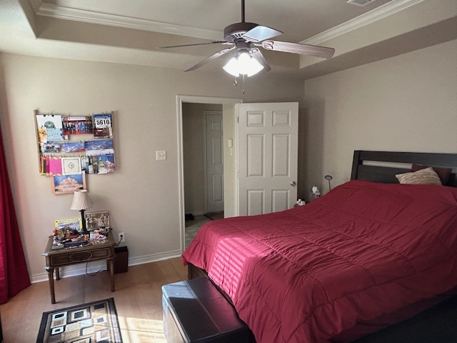 2301 Norham Drive College Station, TX 77845 - Photo 17 of 25 a bedroom with a bed and a chandelier