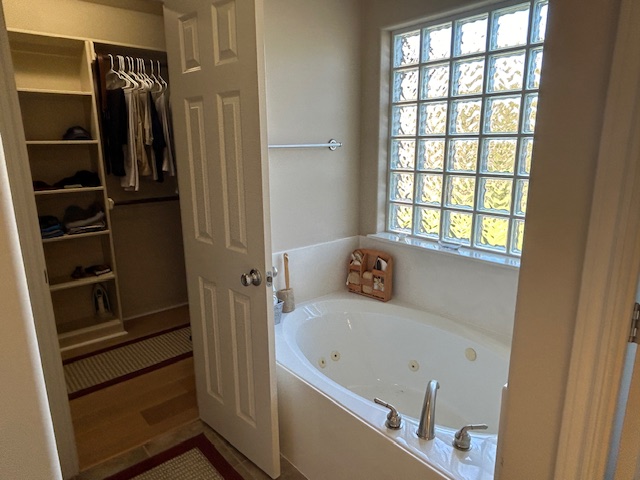 2301 Norham Drive College Station, TX 77845 - Photo 18 of 25 a bathroom with a tub and a window