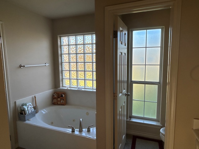 2301 Norham Drive College Station, TX 77845 - Photo 21 of 25 a bath tub sitting in a bathroom next to a window