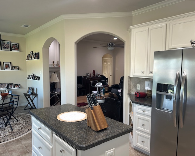 2301 Norham Drive College Station, TX 77845 - Photo 3 of 25 a kitchen with granite countertop stainless steel appliances a sink stove and refrigerator
