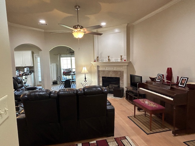 2301 Norham Drive College Station, TX 77845 - Photo 7 of 25 a living room with furniture a fireplace and chandelier