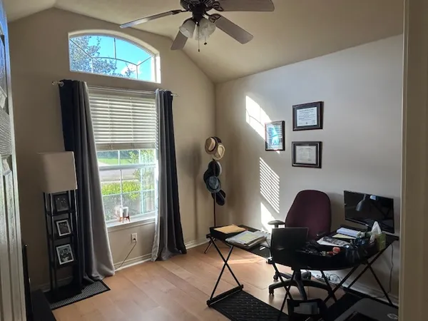 a workspace with furniture and a window