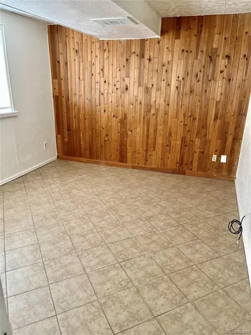 a view of a room with a window and a shower curtain