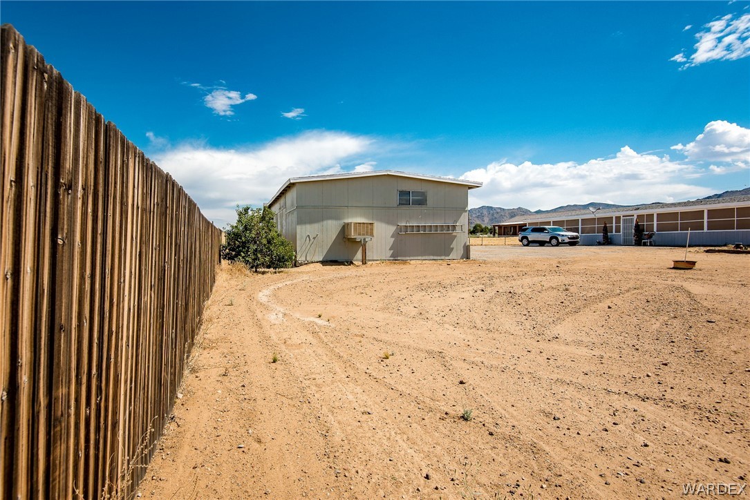3373 Higley Road Golden Valley, AZ 86413 - Photo 22 of 47 a view of large space with a house in the background