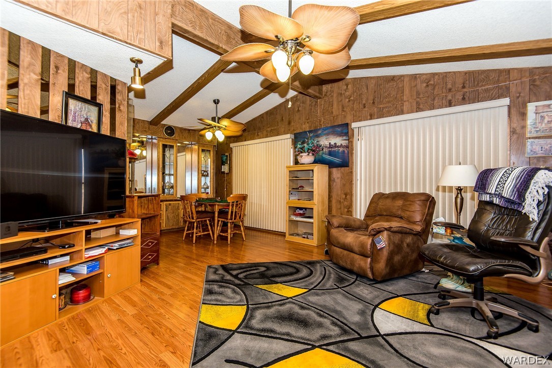 3373 Higley Road Golden Valley, AZ 86413 - Photo 24 of 47 a living room with furniture and a flat screen tv