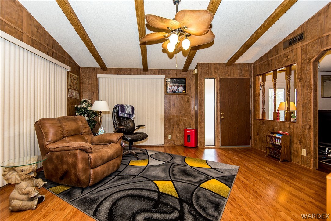 3373 Higley Road Golden Valley, AZ 86413 - Photo 26 of 47 a living room with furniture and a chandelier