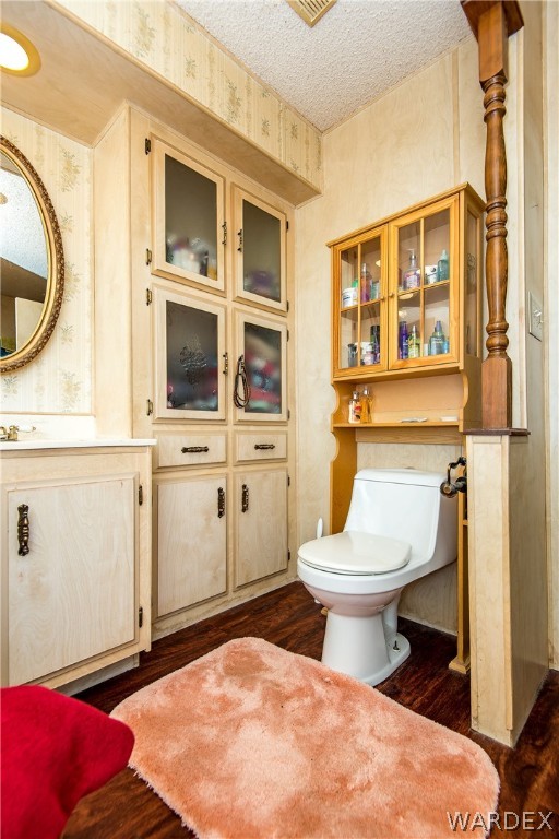 3373 Higley Road Golden Valley, AZ 86413 - Photo 31 of 47 a bathroom with a toilet sink and mirror