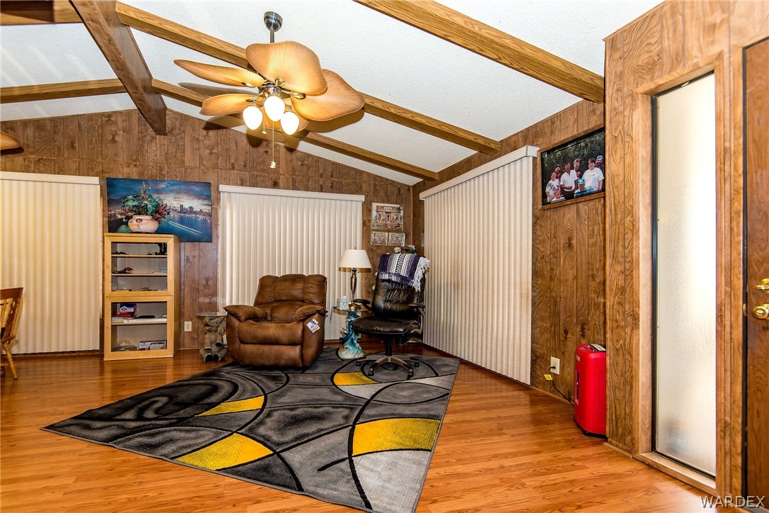 3373 Higley Road Golden Valley, AZ 86413 - Photo 32 of 47 a room with furniture and wooden floor