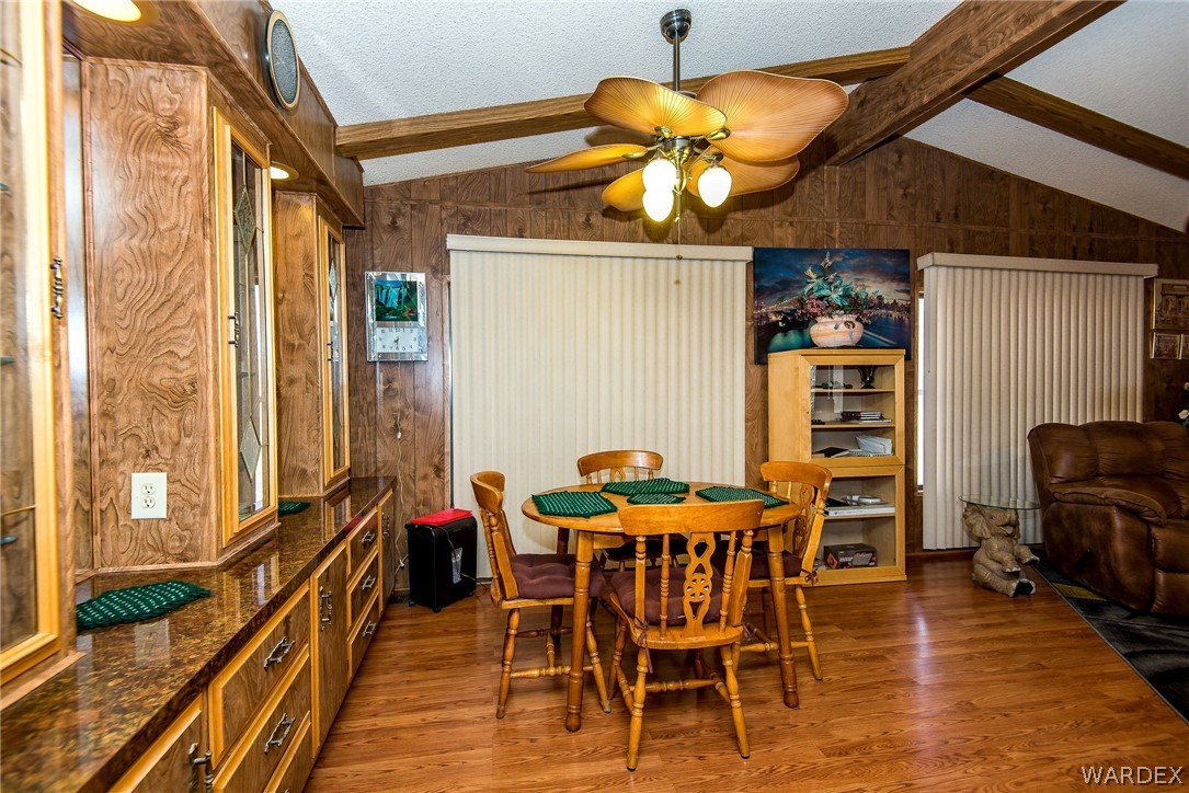 3373 Higley Road Golden Valley, AZ 86413 - Photo 36 of 47 a dining room with furniture and wooden floor