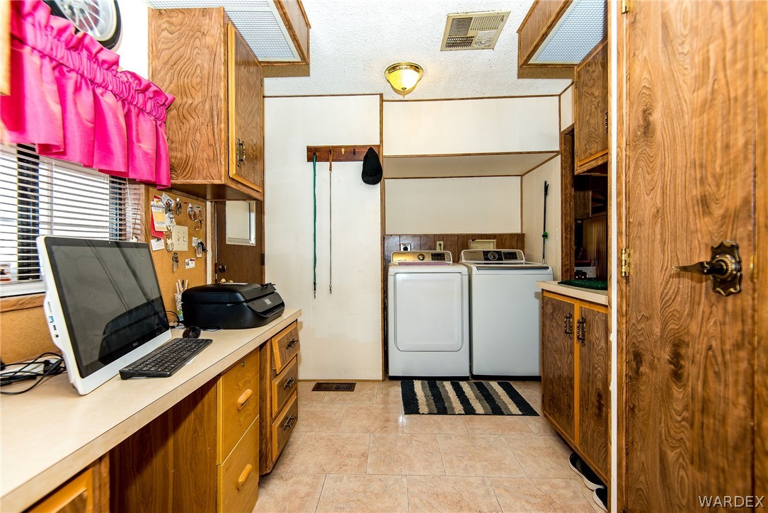 3373 Higley Road Golden Valley, AZ 86413 - Photo 41 of 47 a kitchen with a refrigerator and a stove
