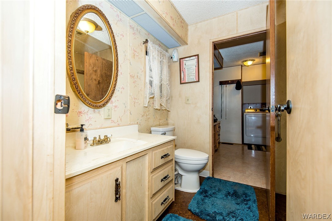 3373 Higley Road Golden Valley, AZ 86413 - Photo 44 of 47 a bathroom with a sink toilet and shower
