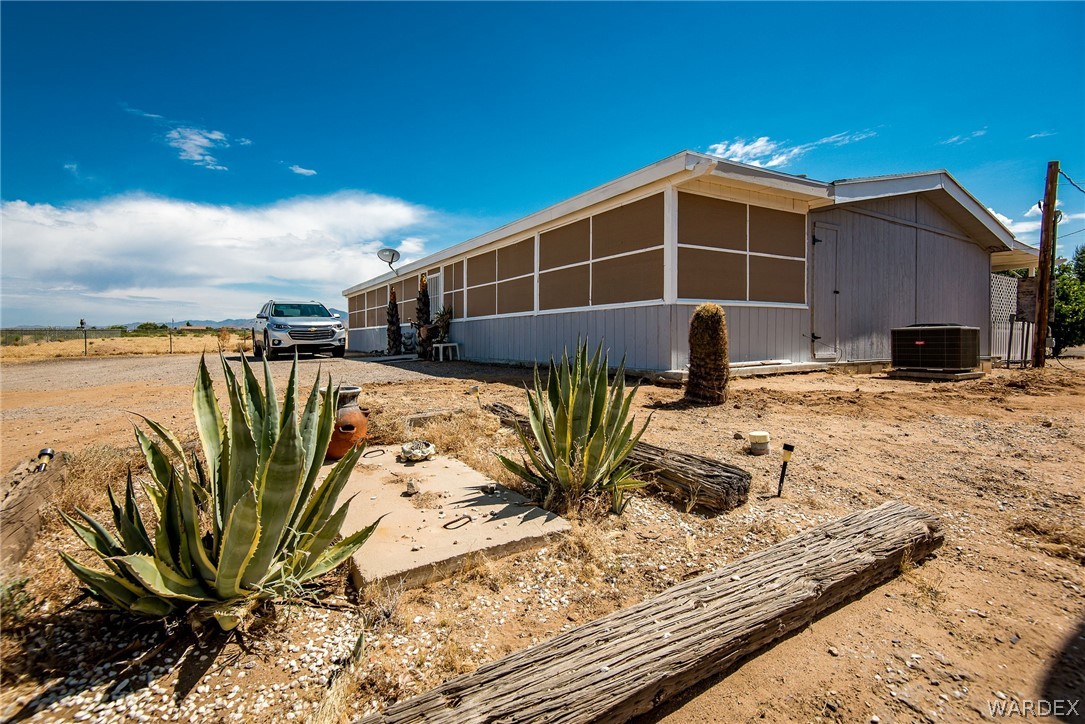 3373 Higley Road Golden Valley, AZ 86413 - Photo 8 of 47 a view of a house with backyard